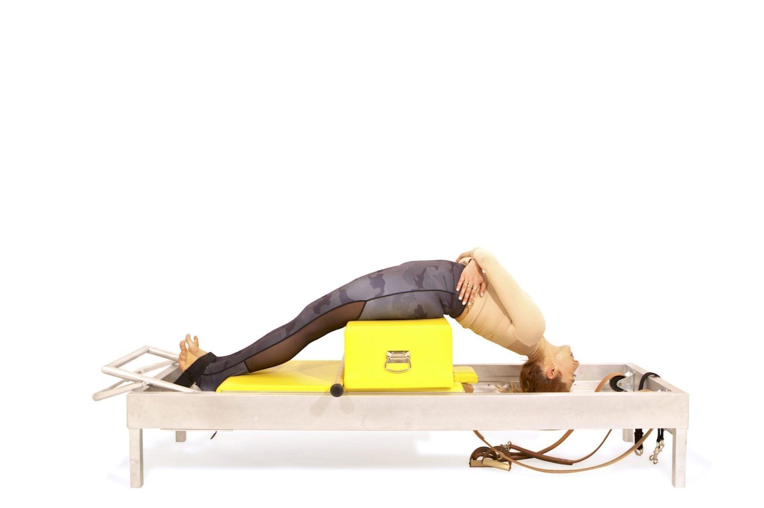 Pilates Knee Stretches Round Back on the Reformer