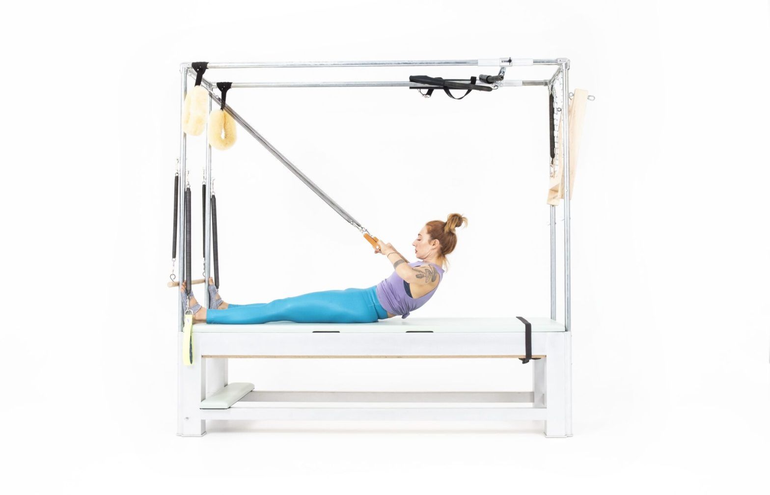 Roll-Back-with-Arm-Springs-on-the-Cadillac Online Pilates Classes