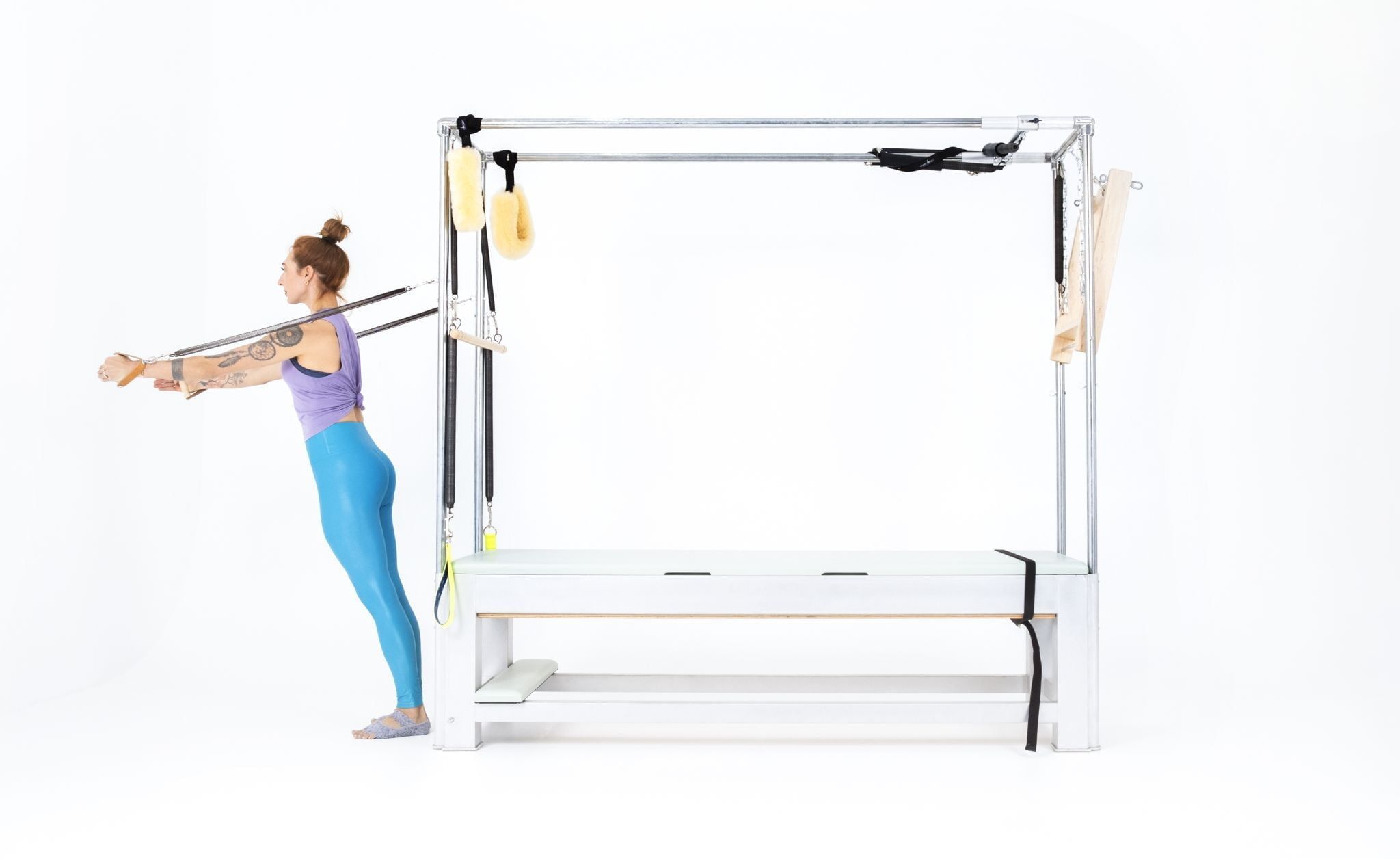 Hug-with-Standing-Arm-Springs-on-the-Cadillac-or-Tower Online Pilates Classes