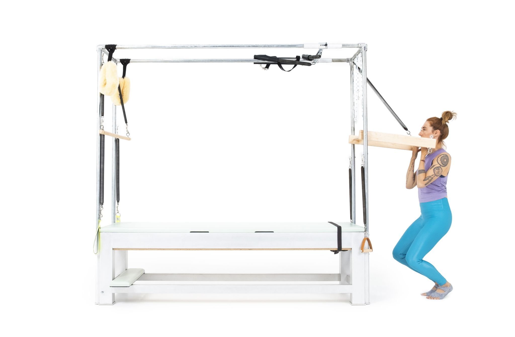 Squats with Push Thru Bar on the Cadillac Online Pilates Classes