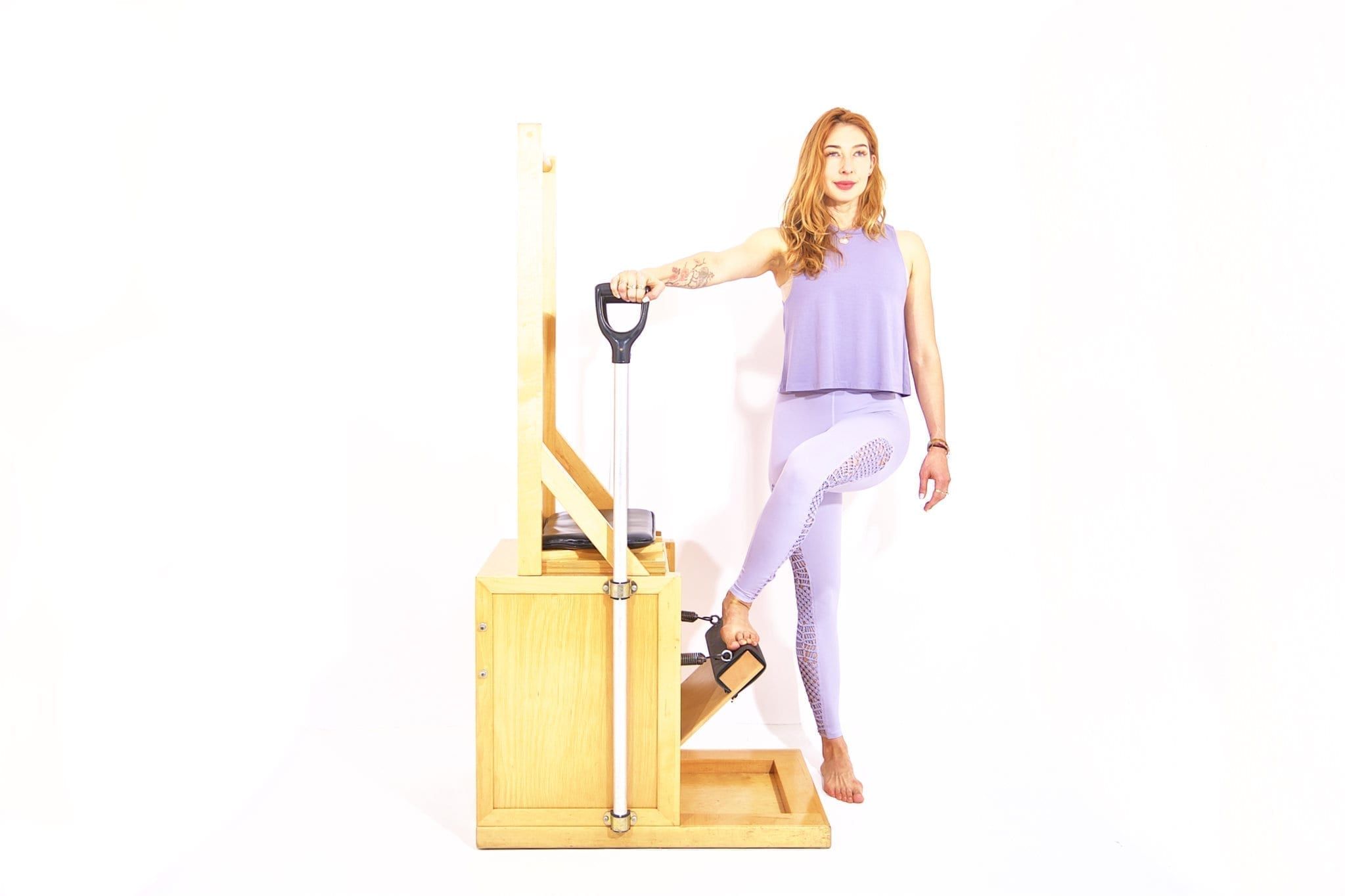 Press-Down-Cross-Over-on-the-High-Chair - Online Pilates Classes