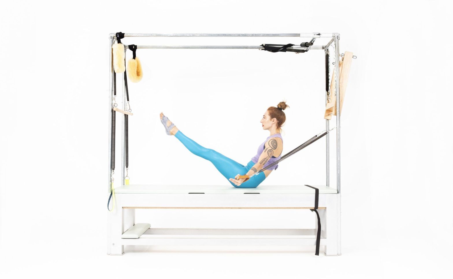 Teaser with Arm Springs on the Cadillac or Tower Online Pilates Classes
